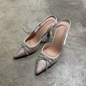 Satin champagne gold rhinestone bow detail pointed heels